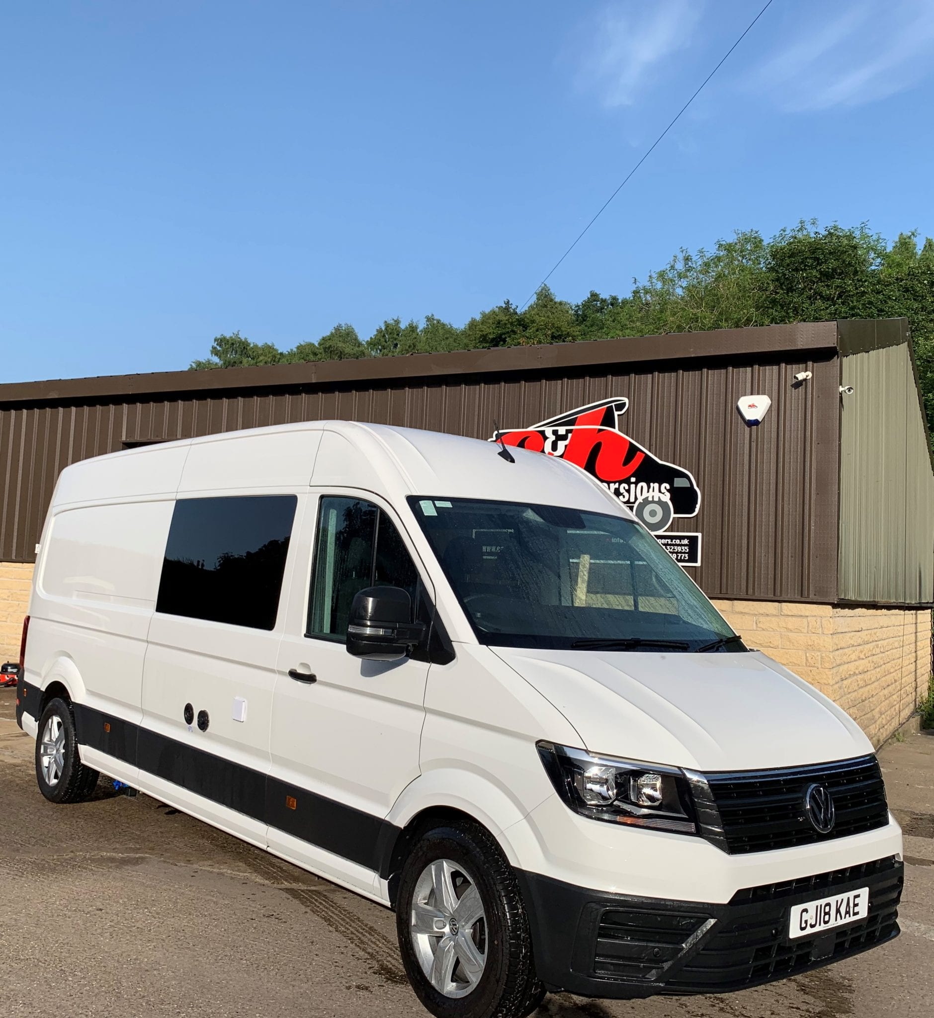 White VW Crafter Campervan Conversion with garage, toilet and shower front