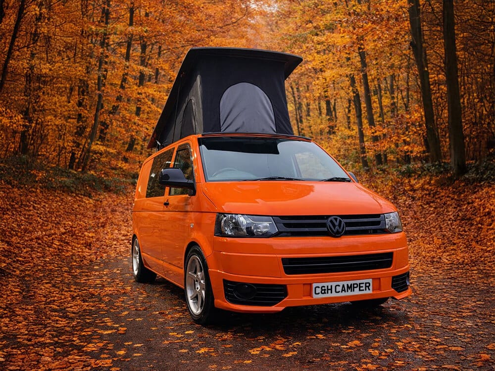 Orange campervan conversion exterior with pop top roof