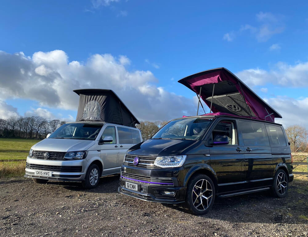 Campervan conversions parked outdoors with pop top roofs